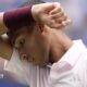 Felix Auger-Aliassime wipes his brow during his US Open defeat by Karen Khachanov